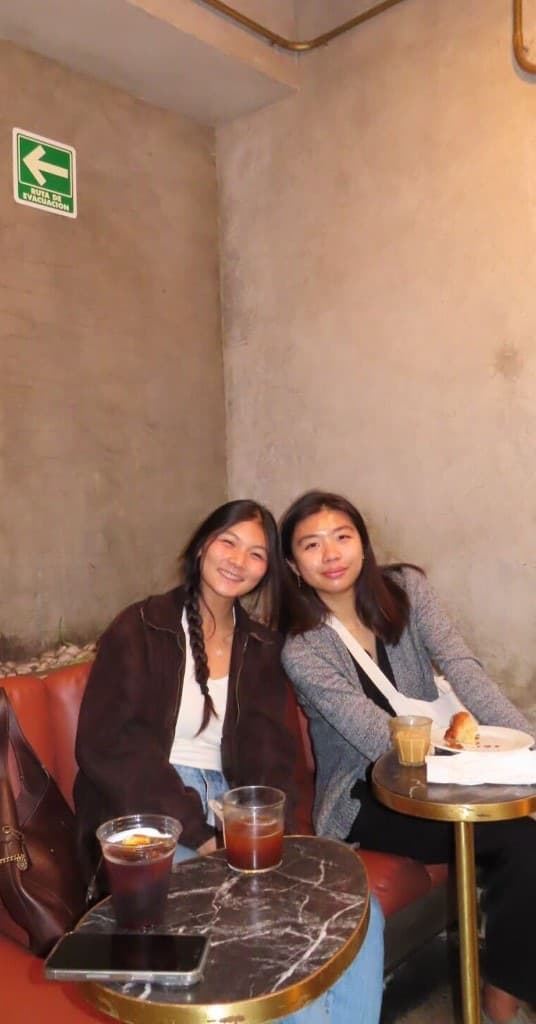 Two Replo teammates having iced coffee in Mexico City