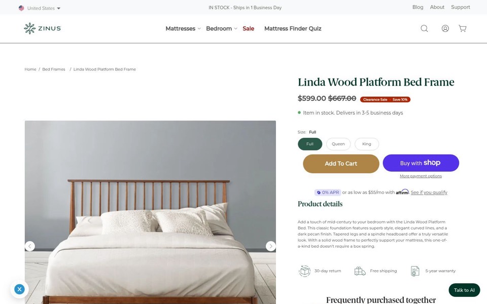 Zinus page for a wood spindle platform bed with clearance price, size buttons and a delivery note